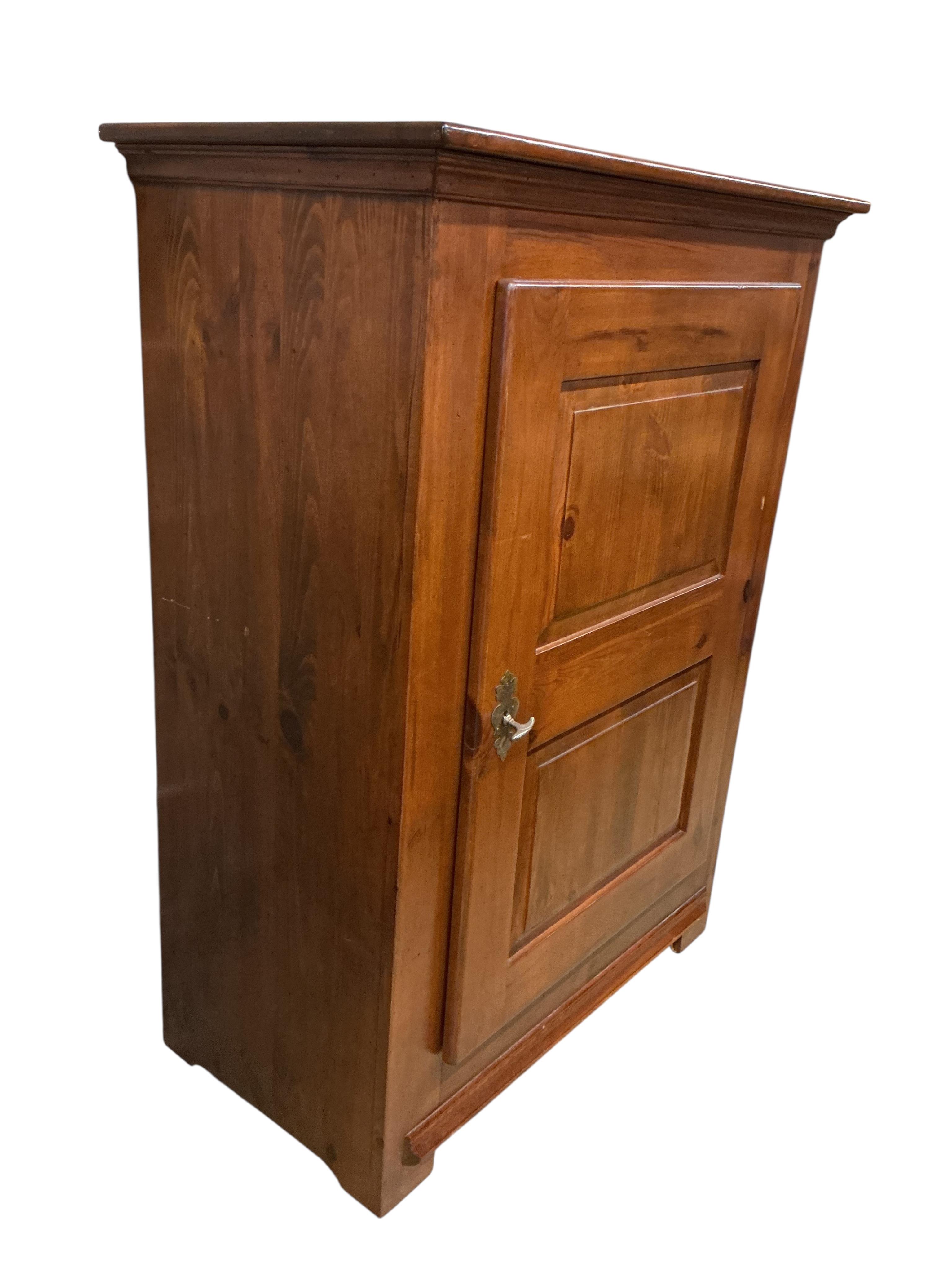 A reproduction 18th century style French pine side cabinet, width 104cm, depth 55cm, height 140cm